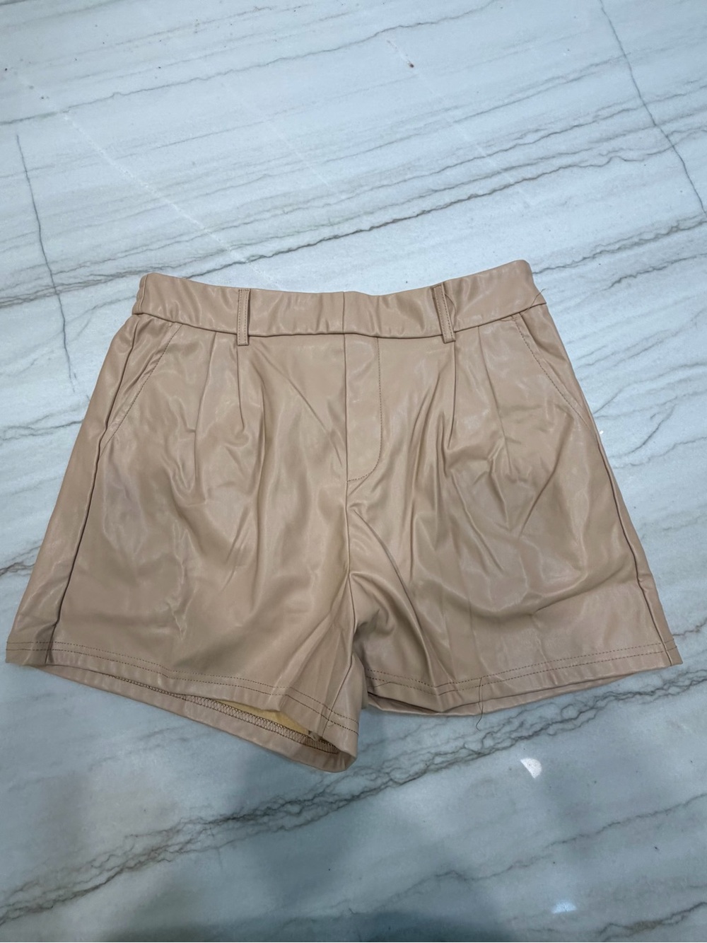 High-Rise Faux Leather Shorts in Nude